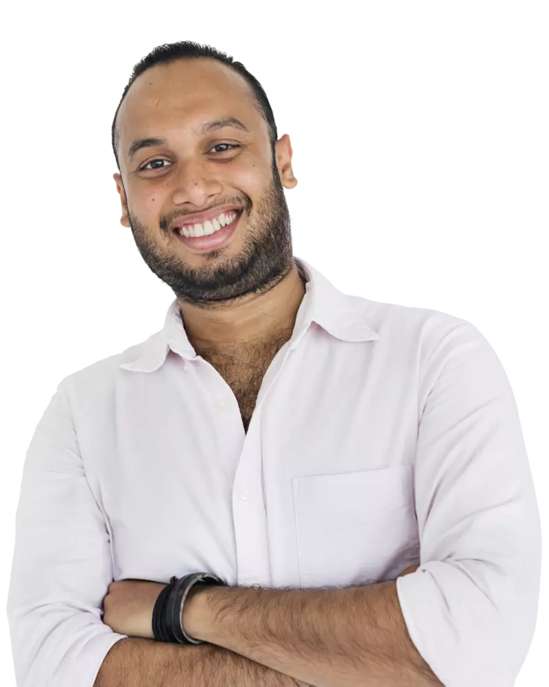 Happy man wearing an off-white coloured shirt with arms crossed smiling at camera